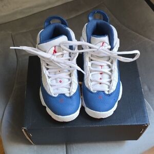 Jordan Kids Blue, Red, and White Athletic Shoes